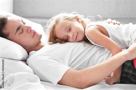 Stepdad sleepeing with stepdaughter .